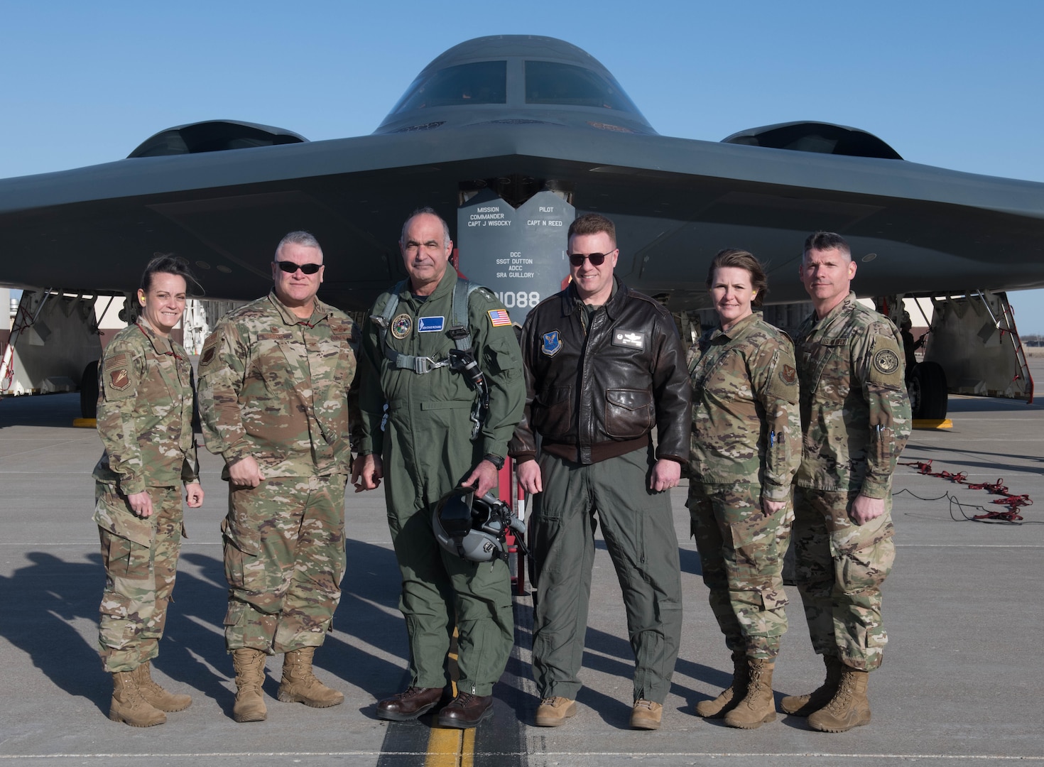 U.S. Navy Admiral Charles Richard, commander of U.S. Strategic Command (USSTRATCCOM) and Chief Master Sgt. Patrick McMahon, USSTRATCOM senior enlisted leader, stand with 509th Bomb Wing and 131th Bomb Wing leadership in front of a B-2 Spirit Stealth Bomber at Whiteman Air Force Base, Missouri, March 5, 2020. Richard and McMahon visited Whiteman AFB to meet with Airmen and leadership and share their perspectives on the strategic deterrence mission. (U.S. Air Force Photo by Airman 1st Class Thomas Johns)