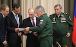 Syrian president Bashar al-Assad (second  from  left), Russian president Vladimir Putin (center), Russian minister of defense Sergei Shoigu (second from right), and chief of the general staff of the Russian Federation armed forces Valery Gerasimov (right) meet 21 November 2017 in Sochi, Russia, to discuss Russian support for operations in Syria.