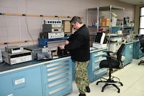 Aviation Electronics Technician Airman Joshua Crawford, Calibration Technician for the Mid-Atlantic Regional Calibration Center, performs Joint Service Electronic Combat Tester repair and calibration for Strike Fighter Squadron 34 (VFA-34) “Blue Blasters” in direct support of flight line readiness.