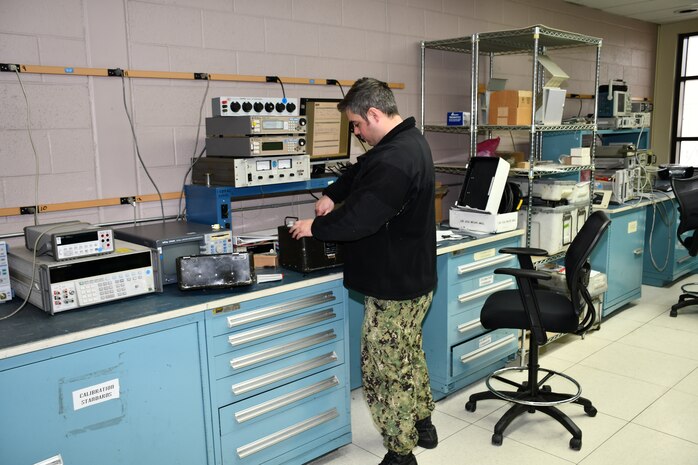Aviation Electronics Technician Airman Joshua Crawford, Calibration Technician for the Mid-Atlantic Regional Calibration Center, performs Joint Service Electronic Combat Tester repair and calibration for Strike Fighter Squadron 34 (VFA-34) “Blue Blasters” in direct support of flight line readiness.
