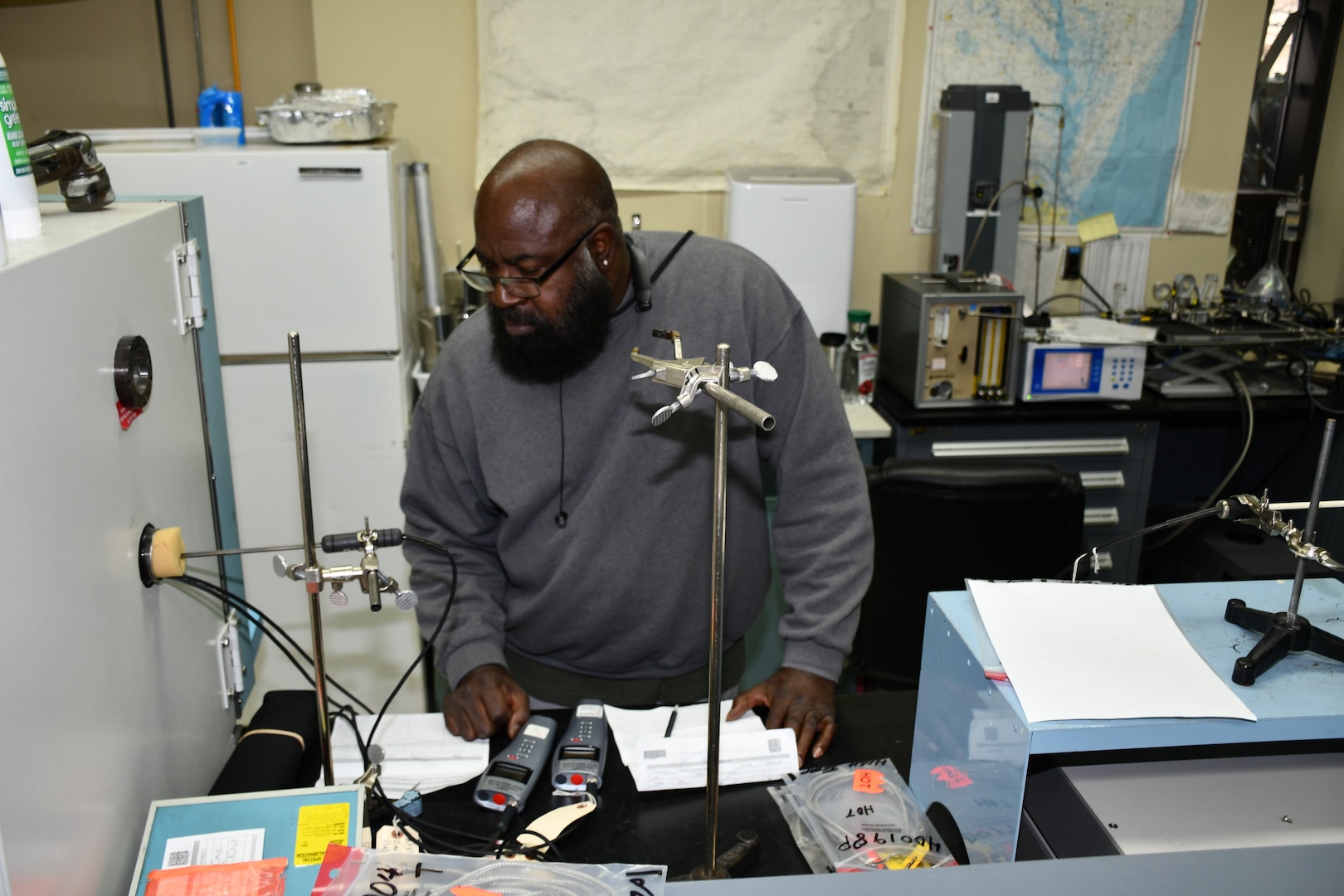 Willie Rhodes, Reference Standards Laboratory Technician for the Mid-Atlantic Regional Calibration Center, performs DM70 Dew Point Meter calibration for Shop 26.