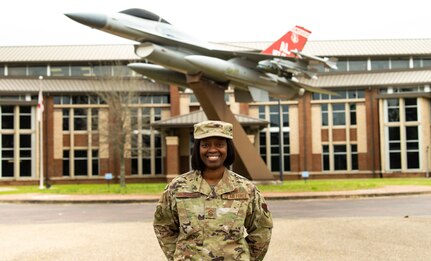 Chief Master Sgt. Bernadette Hollinger, 187th Fighter Wing’s command chief,  in front of the Wing Headquarters building at Dannelly Field, Alabama. Hollinger advises the wing commander, four groups, 11 squadrons and more than 1,300 enlisted Airmen as the senior enlisted member of the wing.