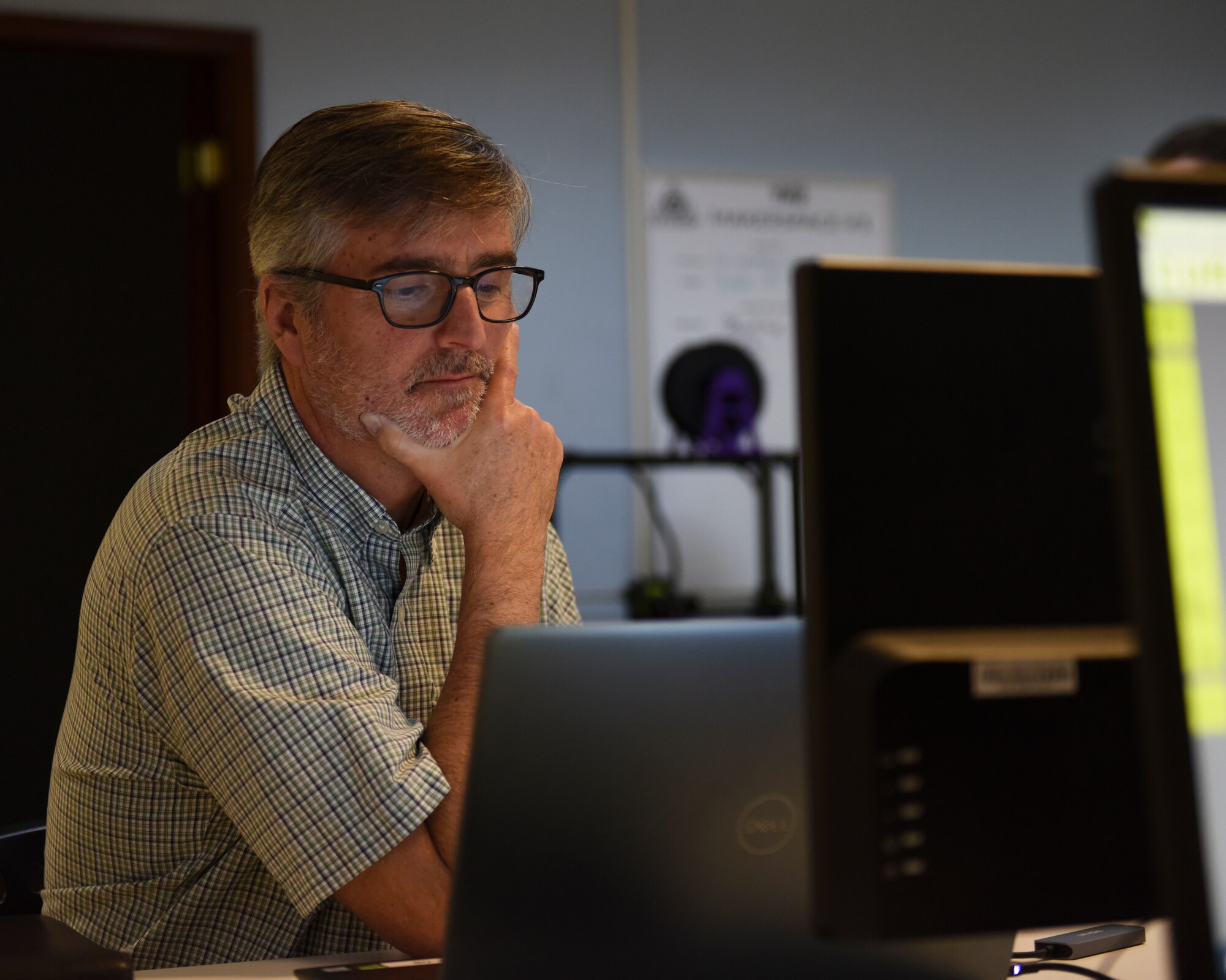 Doug Rider, a senior systems engineer contractor, designs a model on a laptop to 3D print during the U.S. Air Forces Central Command Innovation Summit in the 379th Air Expeditionary Wing’s Desert Spark Lab at Al Udeid Air Base, Qatar, March 3, 2020.