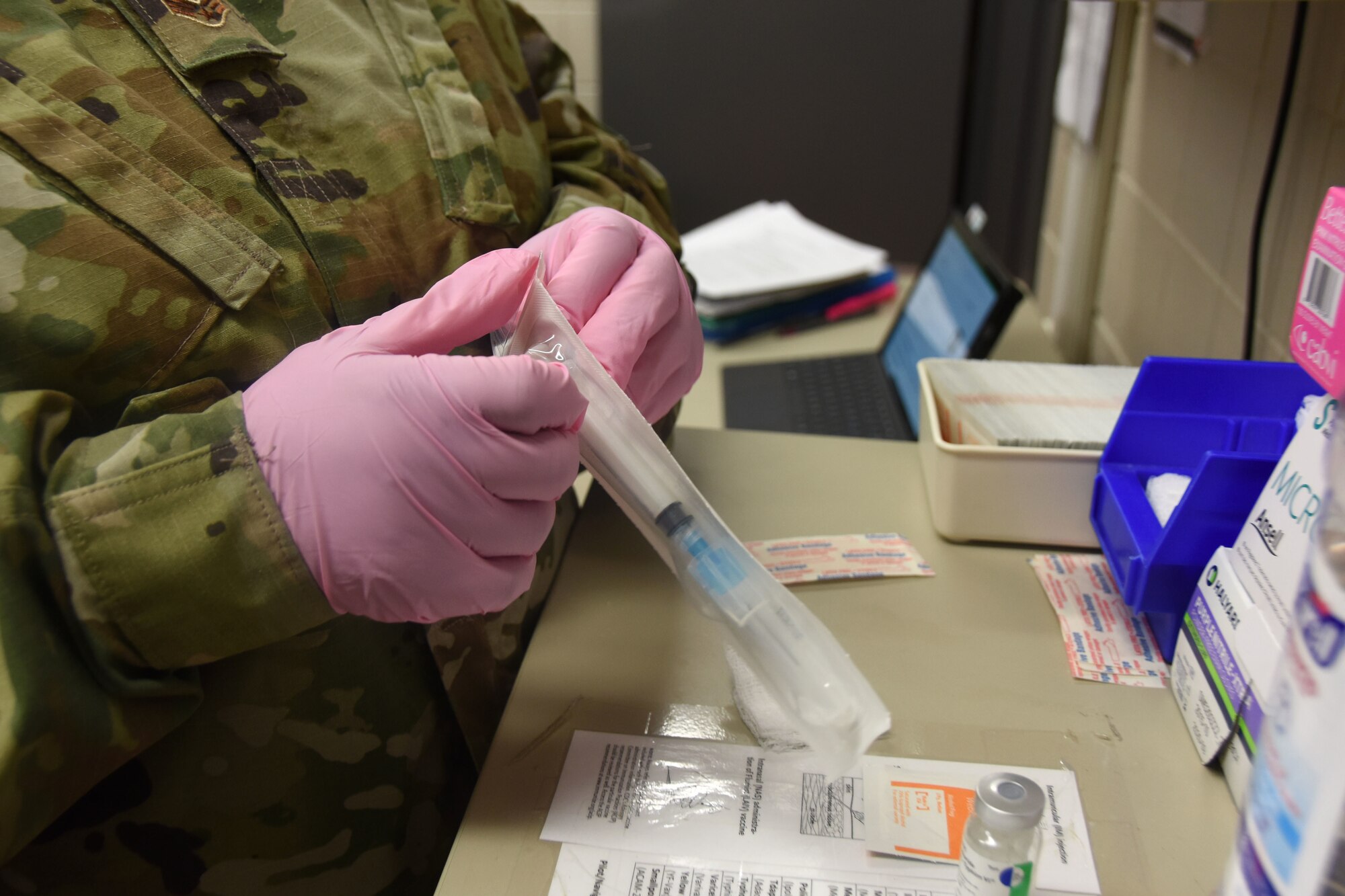 U.S. Air Force Senior Airman Cynthia Ford, 145th Medical Group technician, readies a needle in preparation for giving an immunization at the North Carolina (N.C.) Air National Guard Base, Charlotte Douglas International Airport, Mar. 7, 2020. Senior Airman Ford works as a traditional Guardsman but also serves, in her civilian life, as a Manager for the Department of Juvenile Justice in Marion, S.C. Senior Airman Ford has authored a book titled, ‘Free As An Uncaged Bird,’ which helps acts as a positive and motivational journal, empowering youth and adults. Senior Airman Ford was recently nominated by WBTW News 13 in her local area as Woman of the Year for one of their segments; she has won for her area and will fly to New York mid-March to compete for Woman of the Year Nationally.