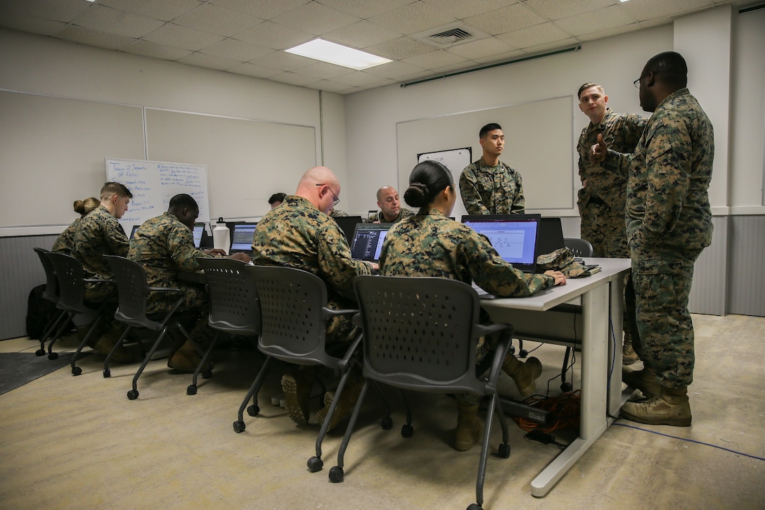 U.S. Marines collaborate together as part of Team Spartan during Cyber Fury 2020 at Camp Lejeune, N.C., Feb. 24.