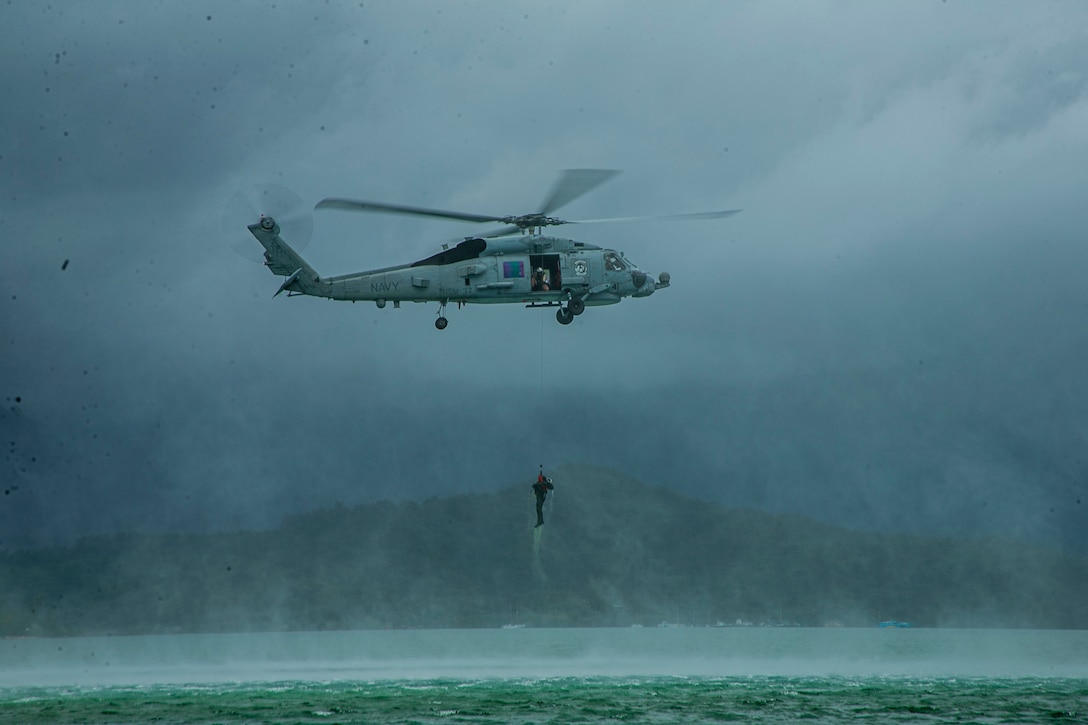 U.S. Marines and Sailors use the MH-60R “Sea Hawk” helicopter to hoist Marines out of the bay at Marine Corps Base Hawaii, Mar. 4.