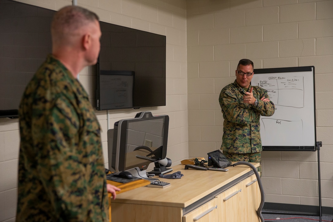 U.S. Marine Col. Carl C. Priechenfried, right, introduces Master Gunnery Sgt. Scott H. Stalker during his visit at Marine Corps Air Station Cherry Point, North Carolina, February 24, 2020. Stalker’s visit was to inform Intel Marines about opportunities the Marine Corps offers as they progress in rank. Stalker is the first Marine to hold the Senior Enlisted Advisor position at Defense Intelligence Agency as well as National Security Agency and the United States Cyber Command. Priechenfried is the G-2 assistant chief of staff, Marine Wing Headquarters Squadron 2, 2nd Marine Aircraft Wing. (U.S. Marine Corps photo by Cpl. Damaris Arias)