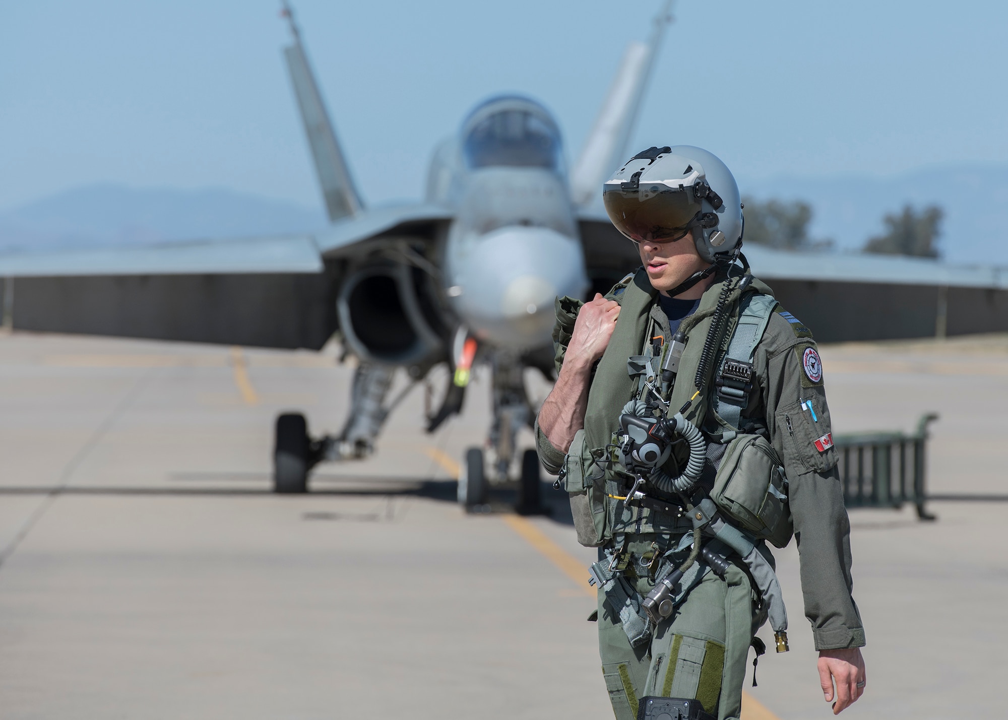 A Royal Canadian air force CF-18 Hornet pilot, assigned to the 433rd Tactical Fighter Squadron in Canadian Forces Base Bagotville, Quebec, Canada, prepares for a flight Feb. 25, 2020, at Luke Air Force Base, Ariz.