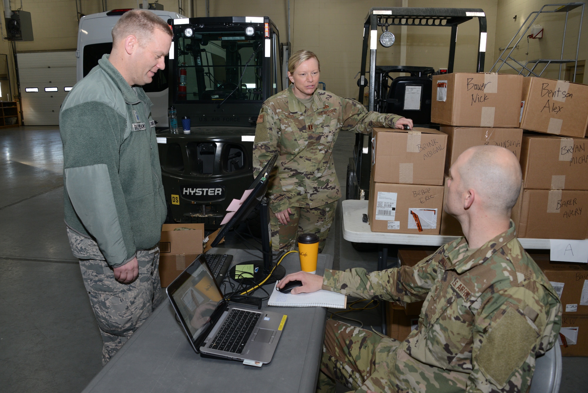 Layne Delperdang uses his common access card to electronically sign for OCP uniforms in Sioux City, Iowa