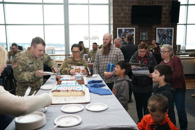 Family and friends gathered to bid farewell to approximately 50 U.S. Army Reserve Soldiers of Detachment 1, 654th Regional Support Group, 364th Sustainment Command (Expeditionary), at a send-off ceremony at CenturyLink Field Event Center, March 6, 2020. DET 1, led by Maj. Thomas Boler, a native of Vancouver, Washington, will deploy to the Middle East in support of Operation Spartan Shield, providing base life support for units rotating through the United States Central Command area of operation. The 654th RSG, headquartered in Tacoma, Washington, deploys to provide base camp sustainment and area security in support of unified land operations. (Photo by U.S. Army Reserve Sgt. Christian Dizon, Unit Public Affairs Representative, 477th Transportation Company)