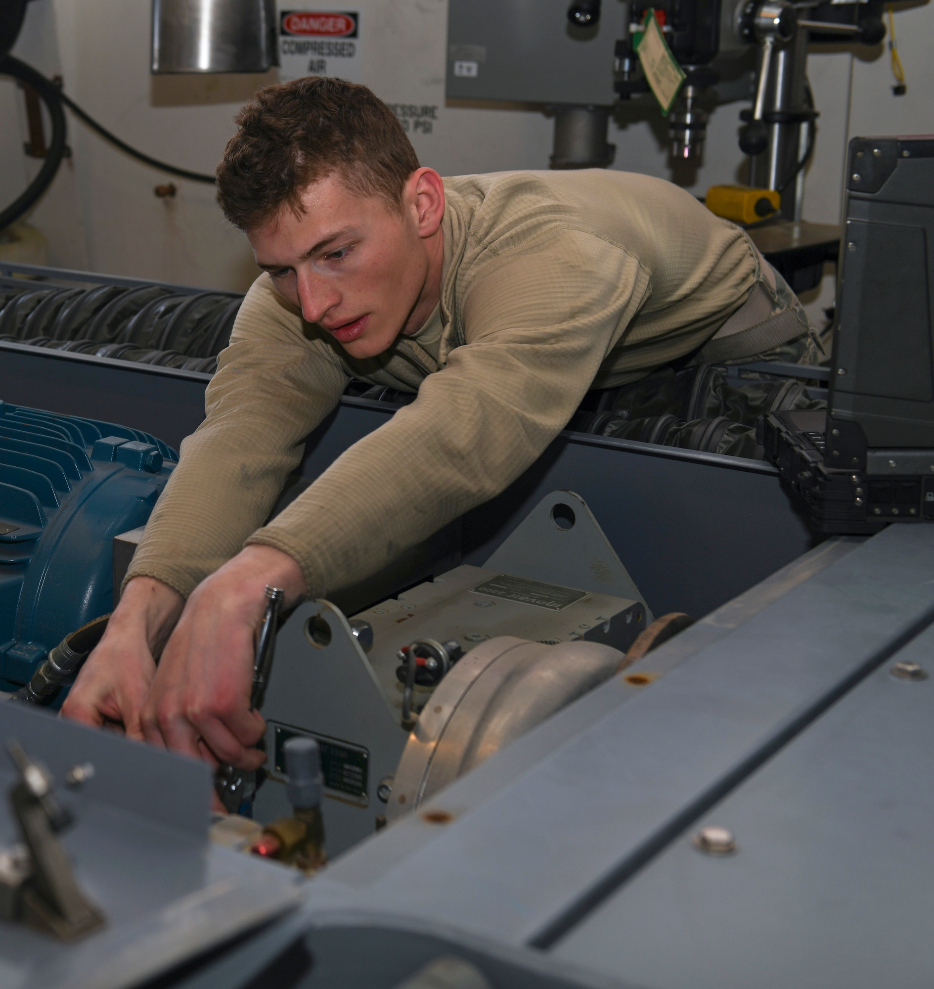 Senior Airman Cole Hardman, an Aerospace Ground Equipment mechanic in the 419th Maintenance Squadron, removes a coalescing filter during an inspection on an electric air cart March 7, 2020, at Hill Air Force Base, Utah