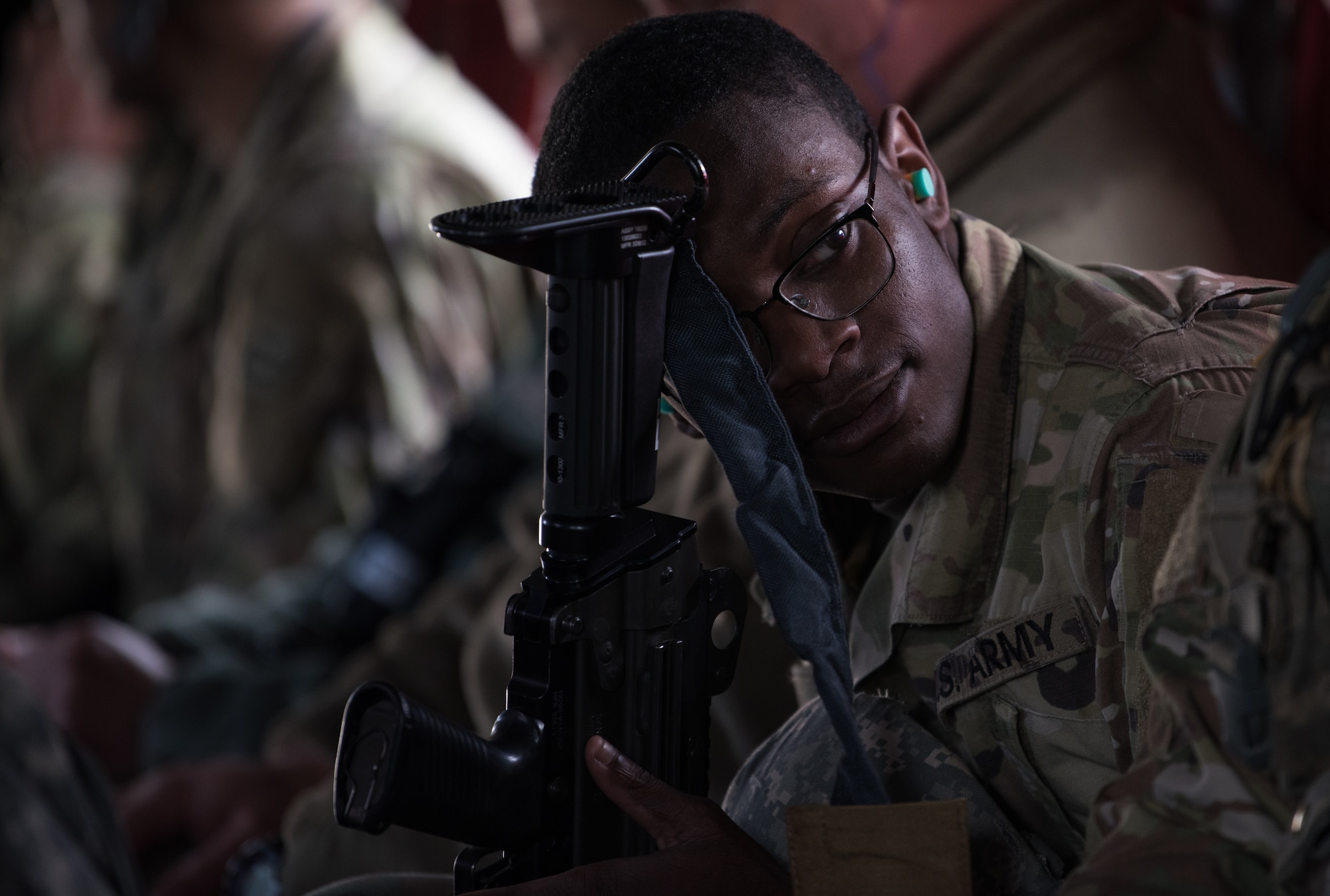 A U.S. Army Soldier rests inside a CH-47 Chinook helicopter on the way to a training at Wilcox, Virginia, March 6, 2020. The helicopter transported 26 Army Reserve Soldiers to the Field Training Exercise. (U.S. Air Force photo by Airman 1st Class Sarah Dowe)