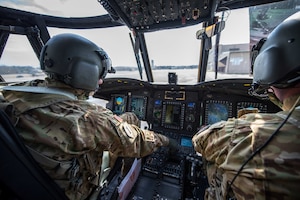 CH-47 Chinook helicopter pilots, Chief Warrant Officer 3 Jesse Bander, Chinook CH-47 pilot 159th General Support Aviation Battalion 244th Bravo Company CH-47 Chinook pilot, and Capt. Cory Moylan, 159th GSAB, 247th Bravo Company commander, perform pre-flight checks prior to taking off from Felker Army Airfield, Joint Base Langley-Eustis, Virginia, March 6, 2020. The pilots regularly support training and real-world flying missions. (U.S. Air Force photo by Senior Airman Anthony Nin Leclerec)