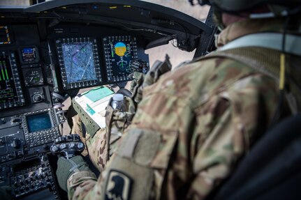 A U.S. Army pilot flies a CH-47 Chinook helicopter after taking off from Felker Army Airfield, Joint Base Langley-Eustis, Virginia, March 6, 2020. The pilots support trainings, combat and humanitarian missions. (U.S. Air Force photo by Senior Airman Anthony Nin Leclerec)