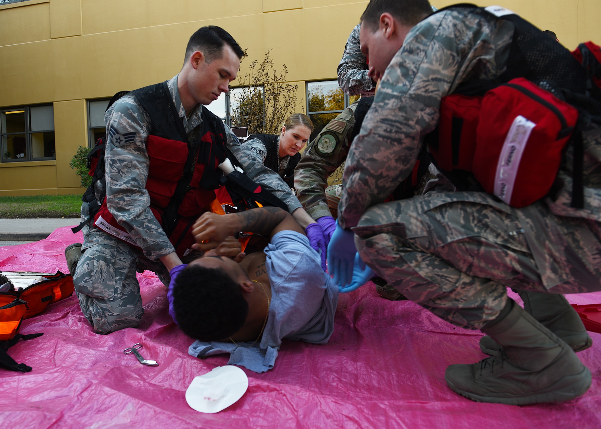 Airmen assigned to the 7th Operational Medical Readiness Squadron simulate stabilizing a medical patient during the 7th Medical Group’s chemical, biological, radiological, and nuclear exercise at Dyess Air Force Base, Texas, March 6, 2020.