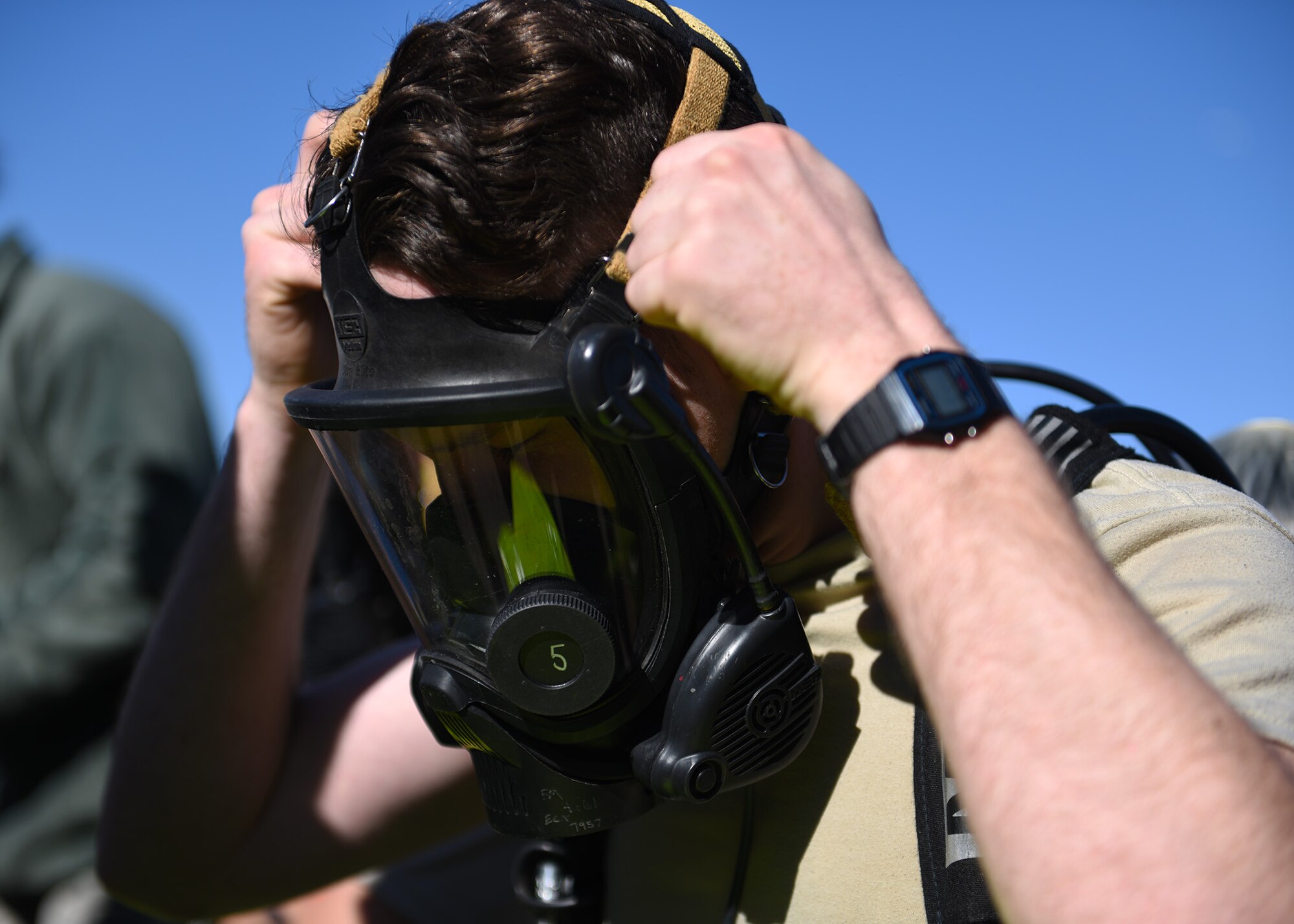 Airman Omar Thompson, 7th Operational Medical Readiness Squadron bioenvironmental engineering technician, puts on a gas mask during the 7th Medical Group’s chemical, biological, radiological and nuclear exercise at Dyess Air Force Base, Texas, March 6, 2020.