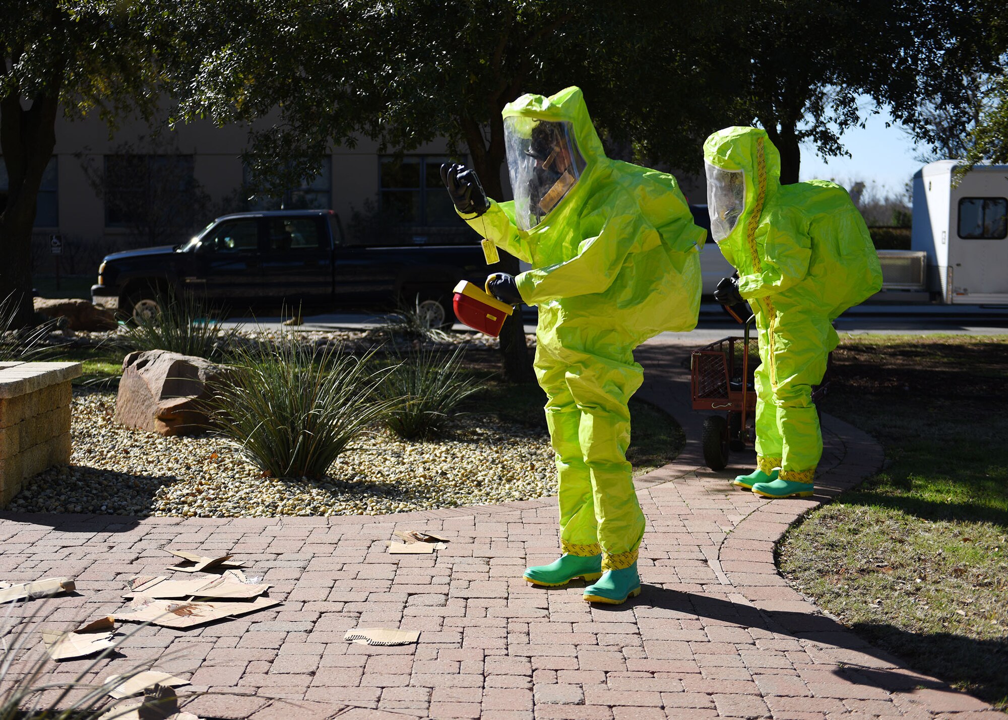 Airman Omar Thompson, 7th Operational Medical Readiness Squadron bioenvironmental engineering technician, front, and Staff Sgt. Micah Thomas, 7th OMRS noncommissioned officer in charge of readiness, survey a simulated explosion site during the 7th Medical Group’s chemical, biological, radiological, and nuclear exercise at Dyess Air Force Base, Texas, March 6, 2020.