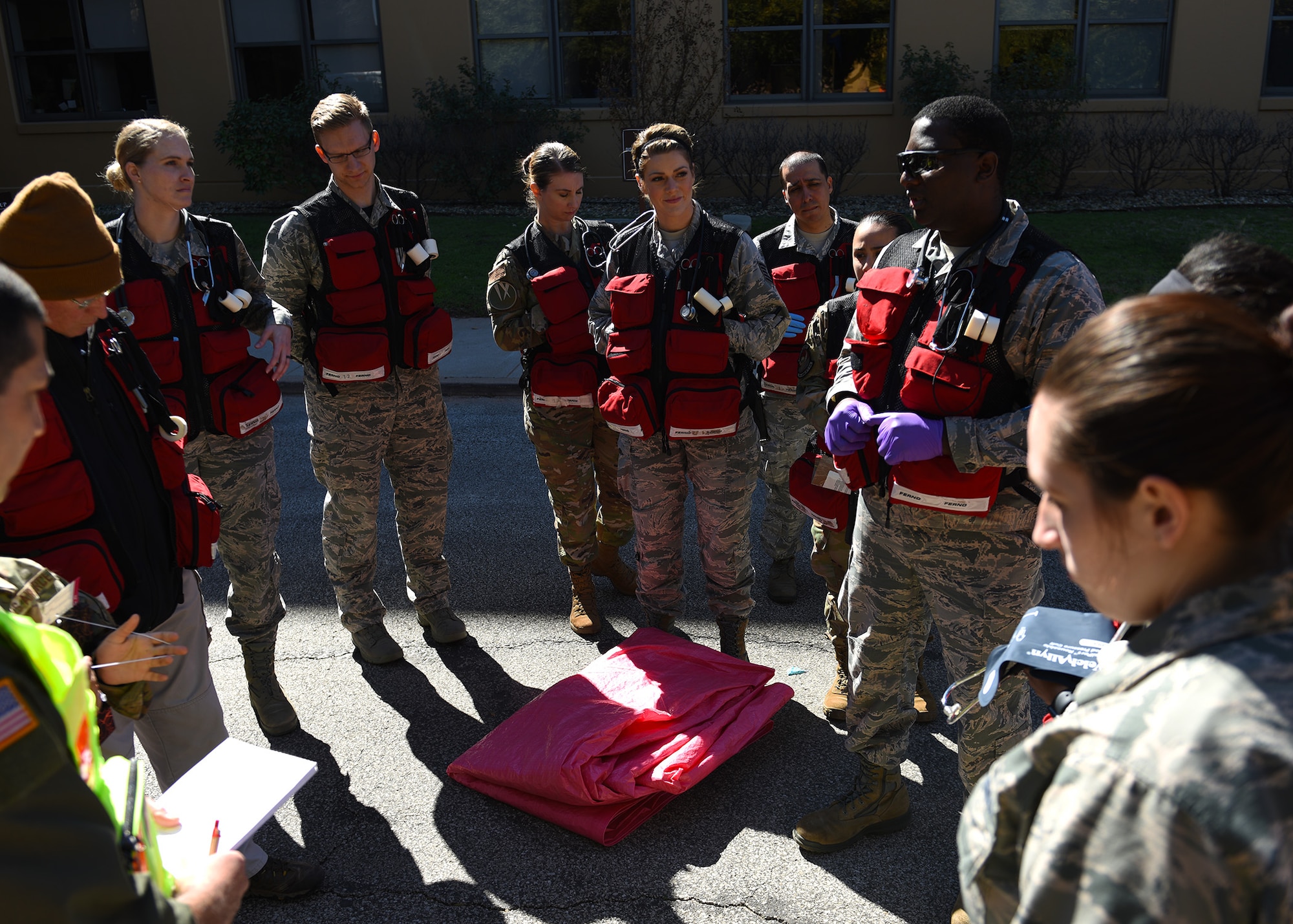 Airmen assigned to the 7th Operational Medical Readiness Squadron huddle to discuss the 7th Medical Group’s chemical, biological, radiological, and nuclear exercise at Dyess Air Force Base, Texas, March 6, 2020.