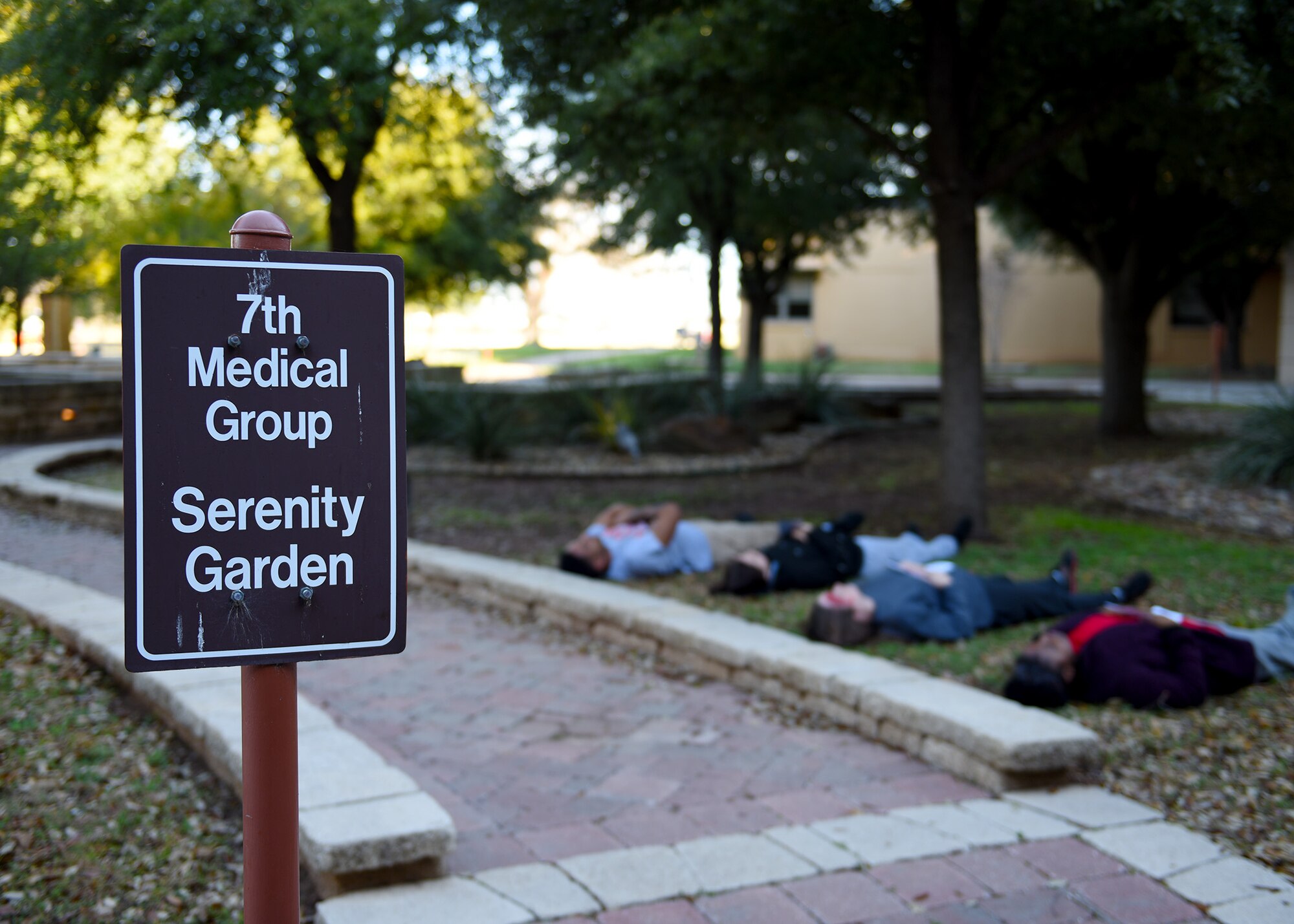 Simulated patients for the 7th Medical Group’s chemical, biological, radiological, and nuclear exercise, lay down in the grass as they wait for medical attention at Dyess Air Force Base, Texas, March 6, 2020.