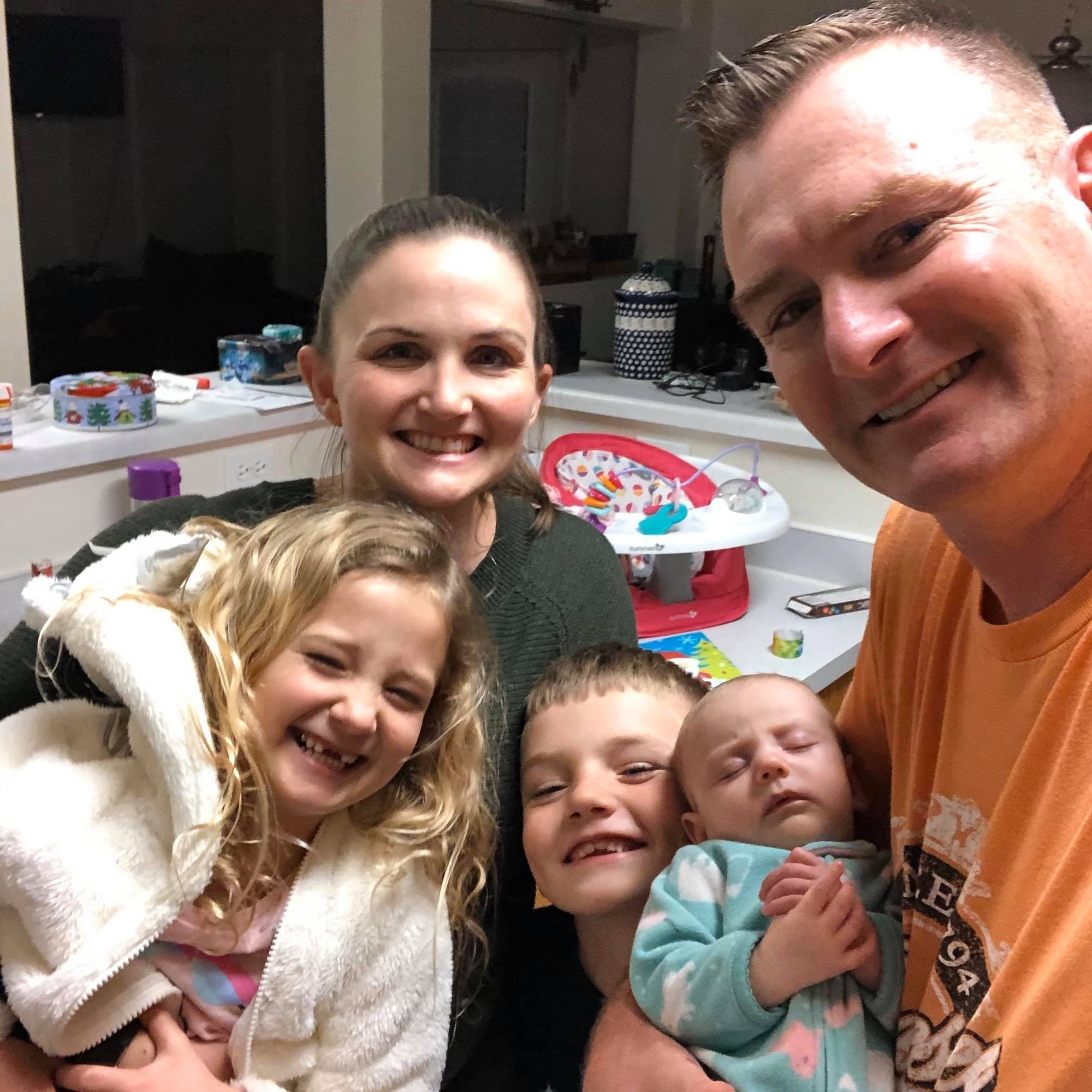 A family gathers for a selfie