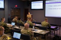 Army Lt. Col. Lien Senchak, Armed Forces Radial Biology Research Institute military medical operations department head, delivers a brief as part of a Medical Effects of Ionizing Radiation (MEIR) course at Joint Task Force Civil Support headquarters.