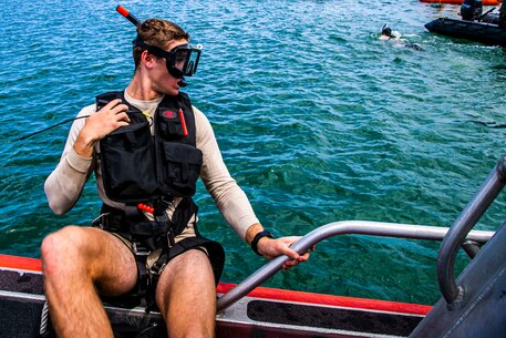 A U.S. Marine with 3rd Radio Battalion prepares to swim during a mishap drill exerciseon Marine Corps Base Hawaii, Mar. 4, 2020. The purpose of the exercise is to make Marines and Sailors more proficient in water rescue operations. (U.S. Marine Corps photo by Lance Cpl. Jacob Wilson)