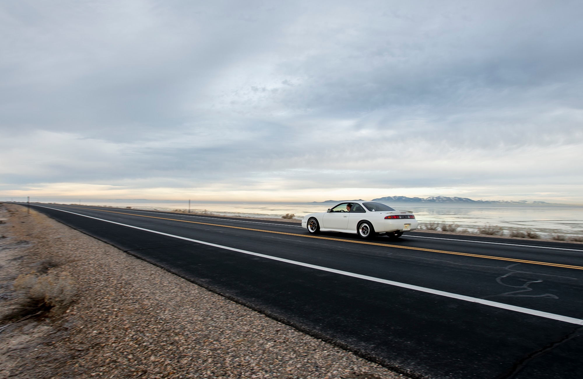 U.S. Air Force Staff Sgt. Brandon Bunn, a 388th Maintenance Group quality assurance inspector and car enthusiast, drives to Antelope Island, Utah, Feb. 2, 2020. On his off-time, Bunn turns wrenches on his 1998 Nissan 240SX drag car. He uses the car as a learning opportunity to teach his daughters about cars and carry on the family hobby. (U.S. Air Force photo by Staff Sgt. Jarrod M. Vickers)