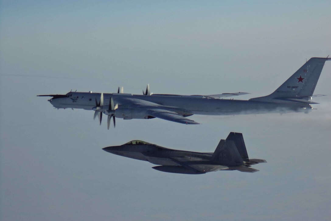 U.S. F-22 escorts Russian aircraft.