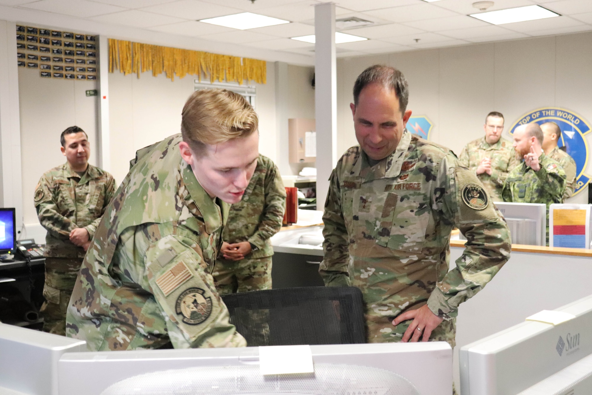 Photo of Airman briefing Major General Shaw