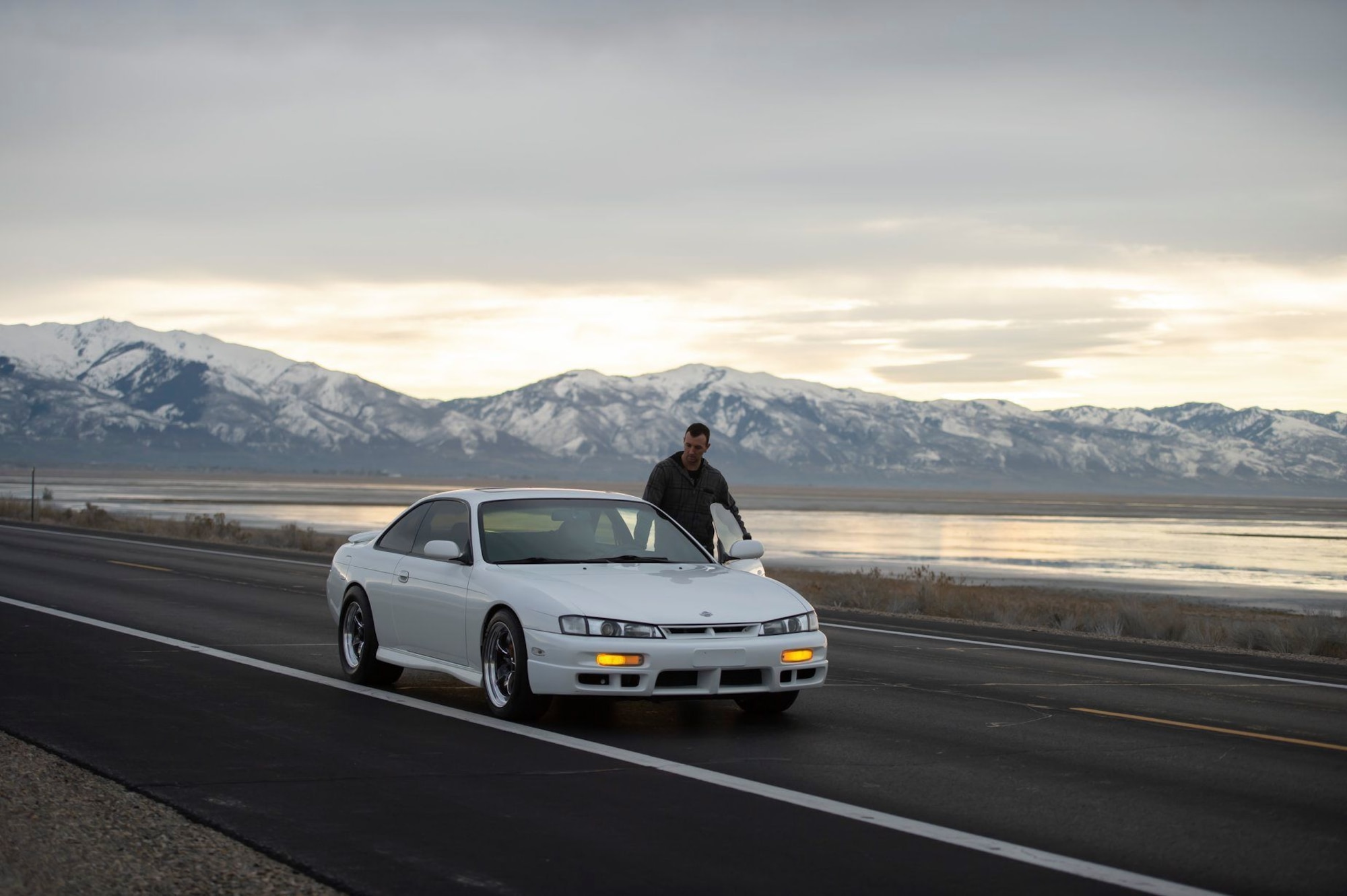 Staff Sgt. Brandon Bunn, a 388th Maintenance Group quality assurance inspector and car enthusiast, gets in his 1998 Nissan 240SX on Antelope Island, Utah, Feb. 2, 2020. His 240SX has a 2JZ-GTE engine from the fourth-generation Toyota Supra and gets more than 500 horsepower to the wheels, reliably. (U.S. Air Force photo by Staff Sgt. Jarrod M. Vickers)