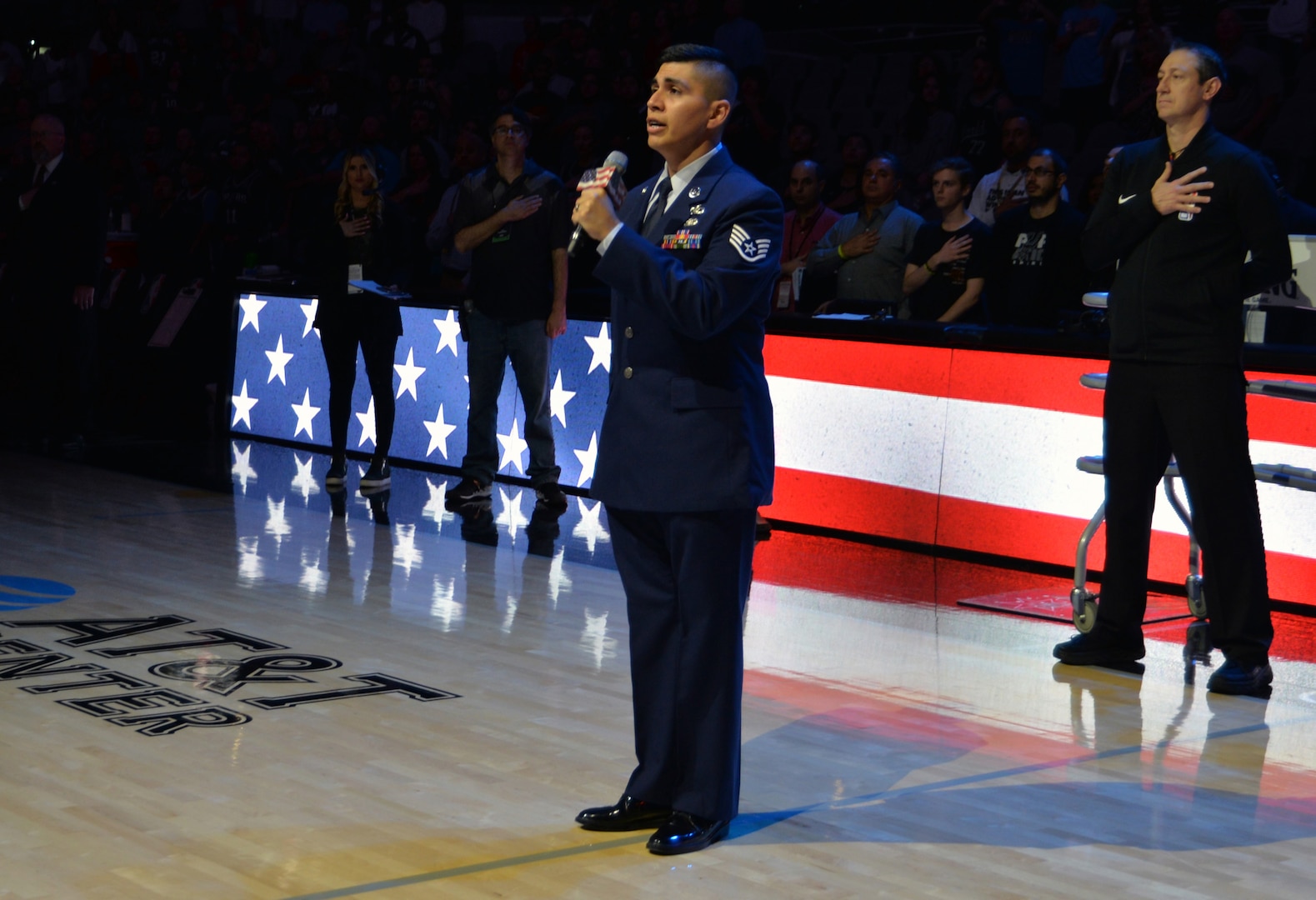 Staff Sgt. Joshua A. Ramos, 433rd Airlift Wing command post controller, sings the Star Spangled Banner before the start of a Spurs basketball game at Military Appreciation Night March 10, 2020 in San Antonio.