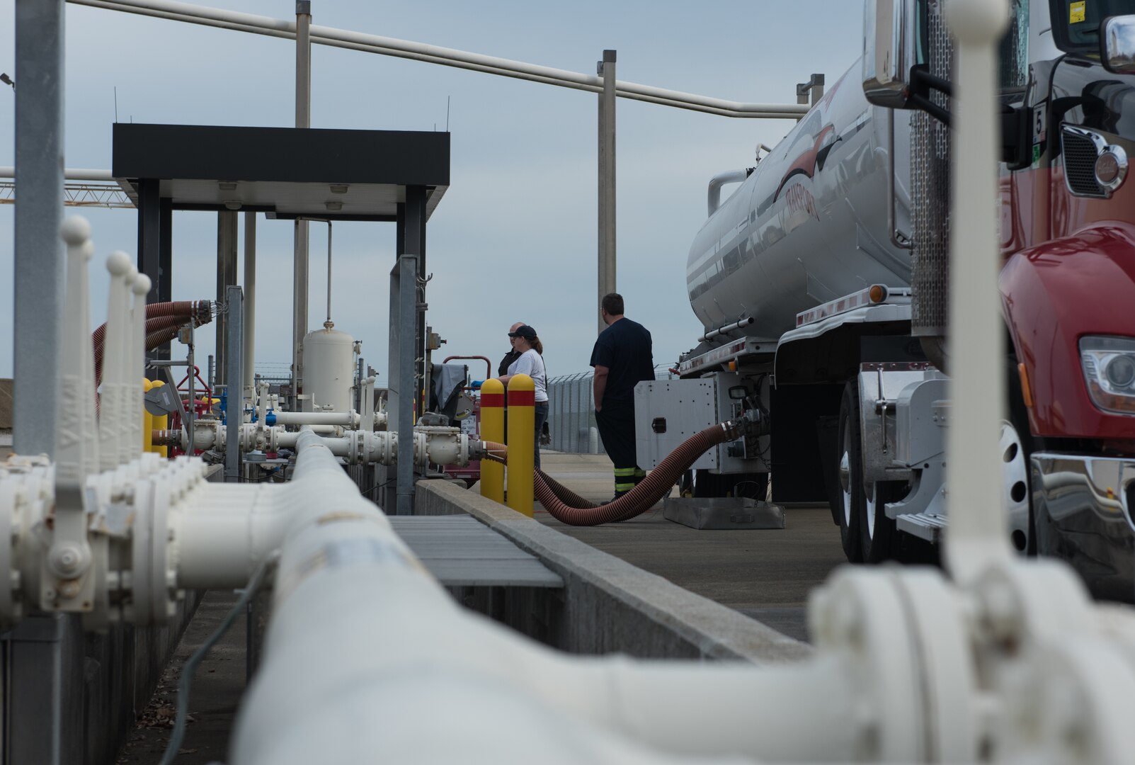 Fuel is pumped through pipes into tanks at Joint Base Langley-Eustis, Virginia, March 10, 2020. Fuel is primarily delivered by barge to JBLE but trucks are the secondary delivery source. (U.S. Air Force photo by Airman 1st Class Sarah Dowe)