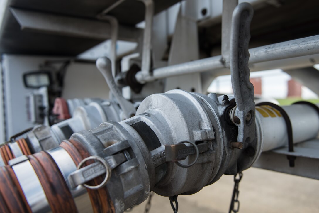 Hoses are hooked to a fuel truck at Joint Base Langley-Eustis, Virginia, March 10, 2020. It takes 30 minutes to unload each truck into storage tanks. (U.S. Air Force photo by Airman 1st Class Sarah Dowe)