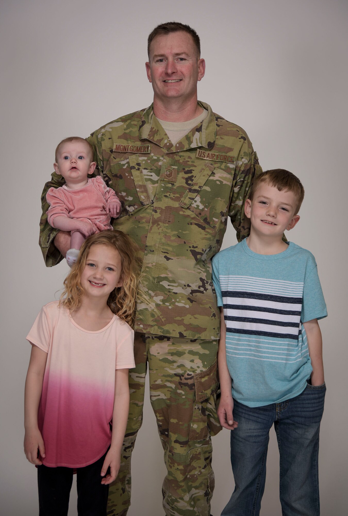 A family poses for a photo.