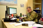 Staff Sgt. Andres Orozco, 31st Force Support Squadron noncommissioned officer in charge of the Passport Office, enters data while processing a passport request on Aviano Air Base, Italy, Feb. 27, 2020. Orozco is part of a two-person team responsible for processing passports for the 31st Fighter Wing. (U.S. Air Force photo by Tech. Sgt. Tory Cusimano)