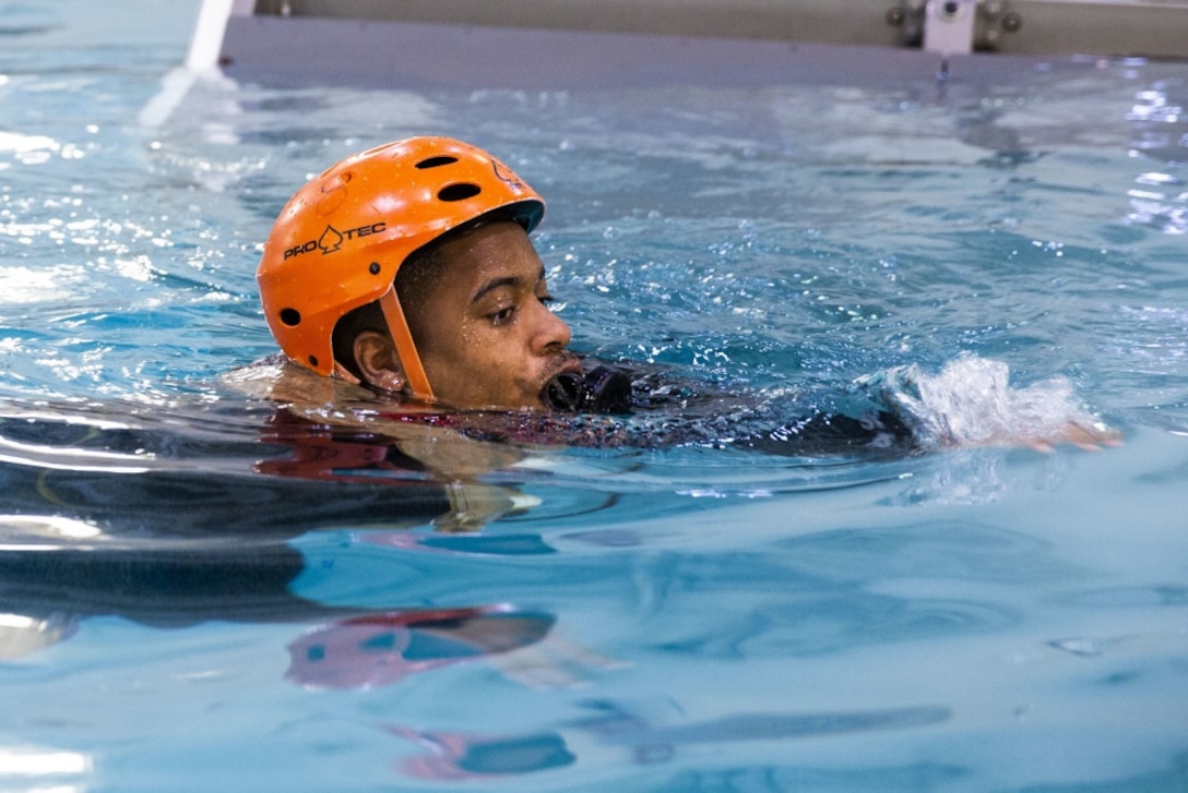 A Marine with the 24th Marine Expeditionary Unit, participates in helicopter underwater egress training at the Water Survival Training Center on Camp Lejeune, North Carolina, February 26, 2020. Egress training provides Marines and Sailors with the confidence to safely and efficiently exit a submerged aircraft. (U.S. Marine Corps photo by Cpl. Margaret Gale)