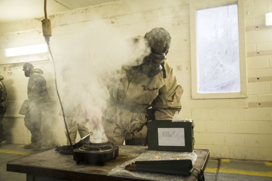 Lance Cpl. James Fyffe, a Chemical, biological, radiological, and nuclear Defense specialist with the 24th Marine Expeditionary unit, breaks chlorobenzalmalononitrile capsules during gas chamber training on Camp Lejeune, North Carolina, February 14, 2020. Marines participate in this training to stay proficient with their mask in case they are exposed to a contaminated environment. (U.S. Marine Corps photo by Cpl. Margaret Gale)