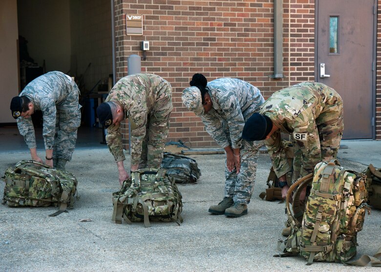 Members of the 459th Security Forces Squadron participate in a ruck march during Unit Training Assembly weekend, March 7, 2020, at Joint Base Andrews, Md. The unit participated in the march as part of their physical fitness training. (U.S Air Force photo/SrA Andreaa Phillips)
