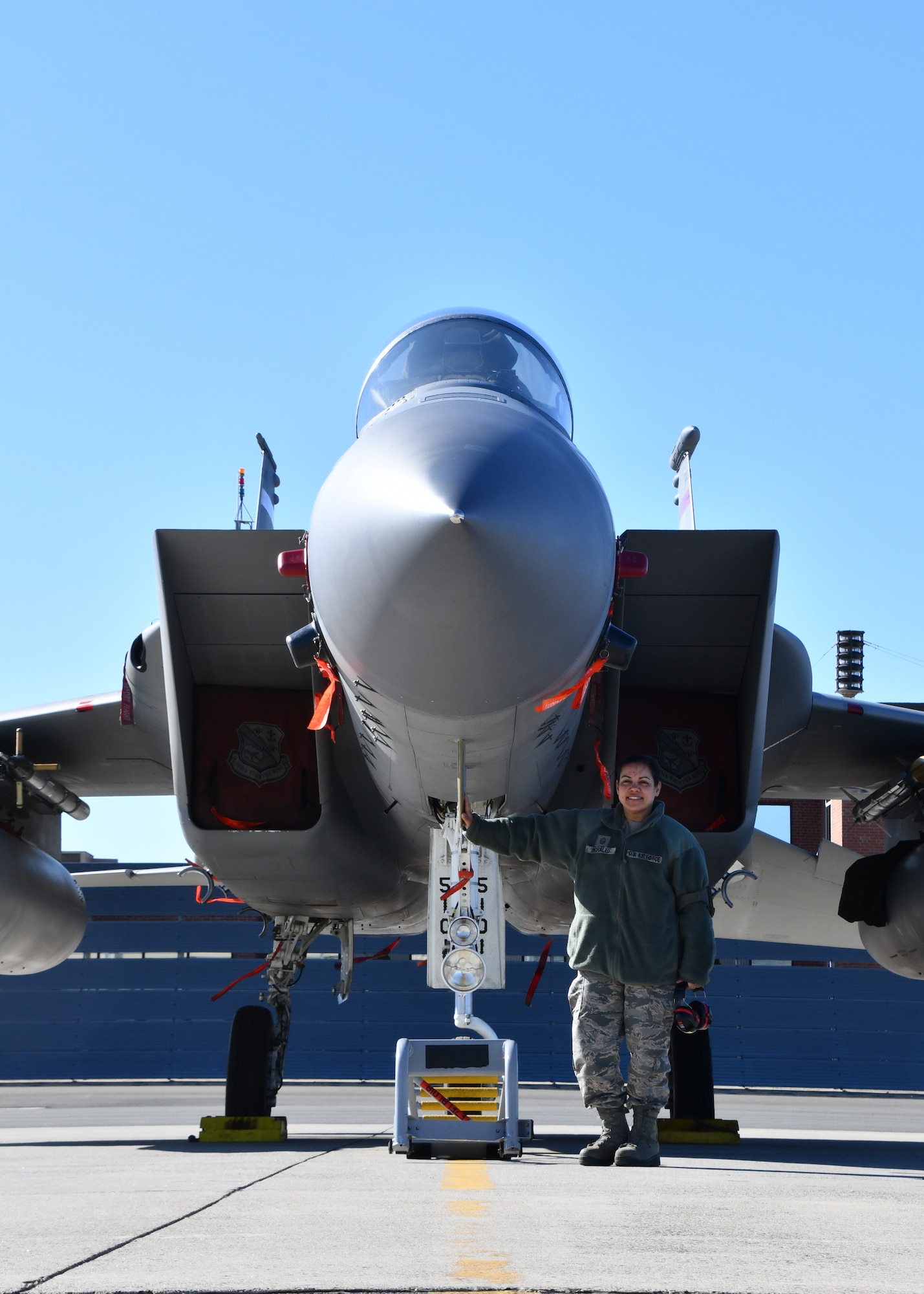 Master Sgt. Marilyn Morales, 104th Maintenance Group avionics flightline technician, stands with an F-15 Eagle she has worked on March, 7, 2020, at Barnes Air National Guard Base, Massachusetts. Morales is a First Segreant on drill weekends and an avionics flightline technician during the week. (U.S. National Guard video by Airman Basic Sara Kolinski)