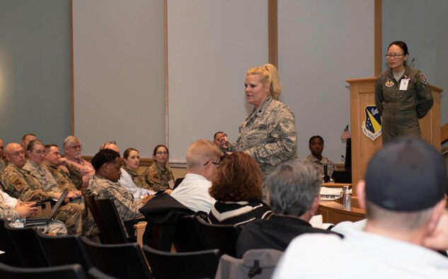 Lt. Col. Karen Kramer, 88th Aerospace Medicine Squadron’s Public Health Flight commander, center, briefs the audience during a COVID-19 tabletop exercise on March 11 inside the Wright-Patterson Medical Center auditorium while Lt. Col. (Dr.) Hui Ling Li, installation public health emergency officer and 88 MDG chief of Aerospace Medicine, stands by. Li functions as the base’s ‘incident commander’ during any public health emergency. (U.S. Air Force photo/Senior Airman Emily Rupert)