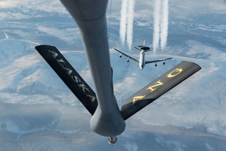 An aircraft flies behind another one.