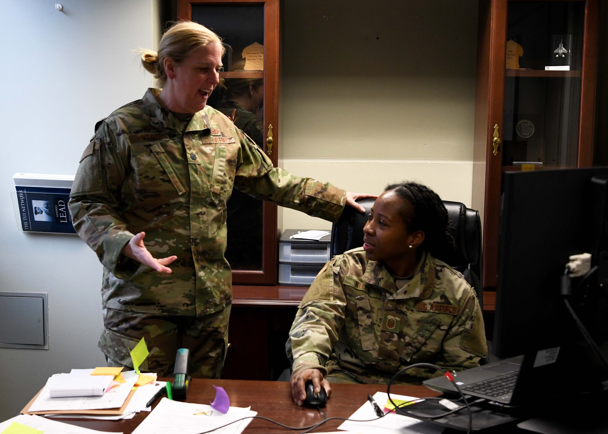Lieutenant Colonel Wendy Kiepke works with Master Sgt. Neisha Nixon to ensure service members get paid. Kiepke oversees finances for the base and advises commanders on how to budget appropriately. (U.S. Air National Guard photo by Airman Camille Lienau)