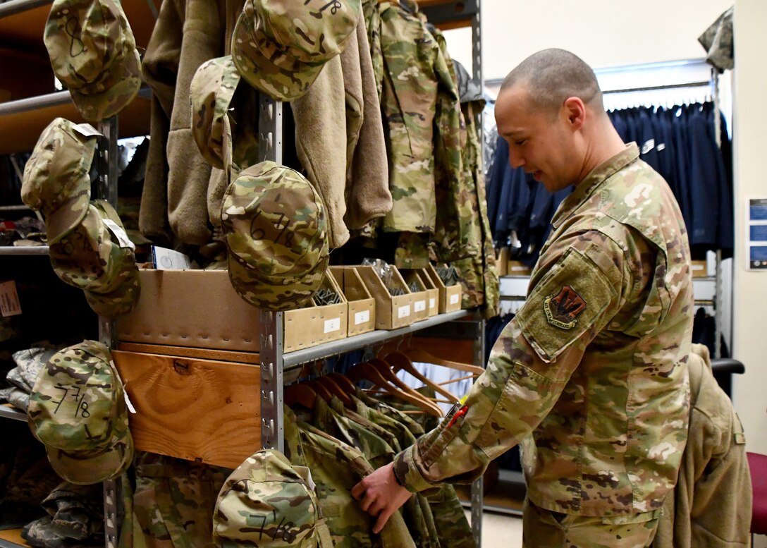 Technical Sergeant Emery McClinton, 104th Logistics Readiness Squadron material manager, sorts through jackets in retail sales, March 7, 2020, at Barnes Air National Guard Base, Massachusetts. McClinton won the 2020 state-wide non-comissioned officer of the year award. (U.S. National Guard video by Airman Basic Sara Kolinski)