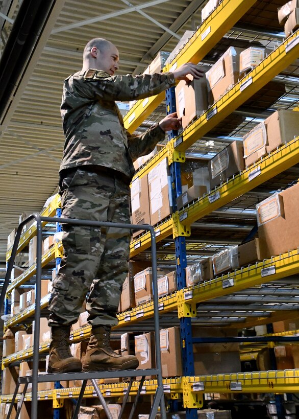 Technical Sergeant Emery McClinton, 104th Logistics Readiness Squadron material manager, inspects property in the main LRS warehouse, March 7, 2020, at Barnes Air National Guard Base, Massachusetts. McClinton won the 2020 state-wide non-comissioned officer of the year award. (U.S. National Guard video by Airman Basic Sara Kolinski)