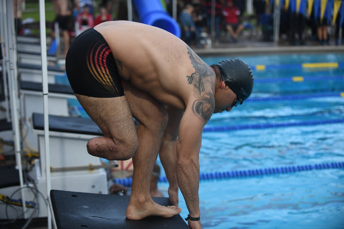 U.S. Marine Corps Capt. Thomas Benge prepares for his relay during the swimming finals of the 2020 Marine Corps Trials at Marine Corps Base Camp Pendleton, Calif., March 10.