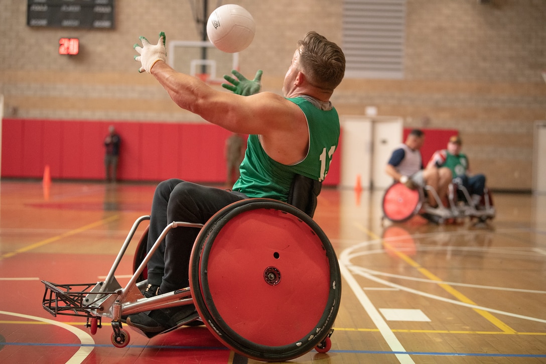 U.S. Marine Corps Gunnery Sgt. Steve Mckay catches the ball during the 2020 Marine Corps Trials wheelchair rugby competition at Marine Corps Base Camp Pendleton, Calif., March 9.