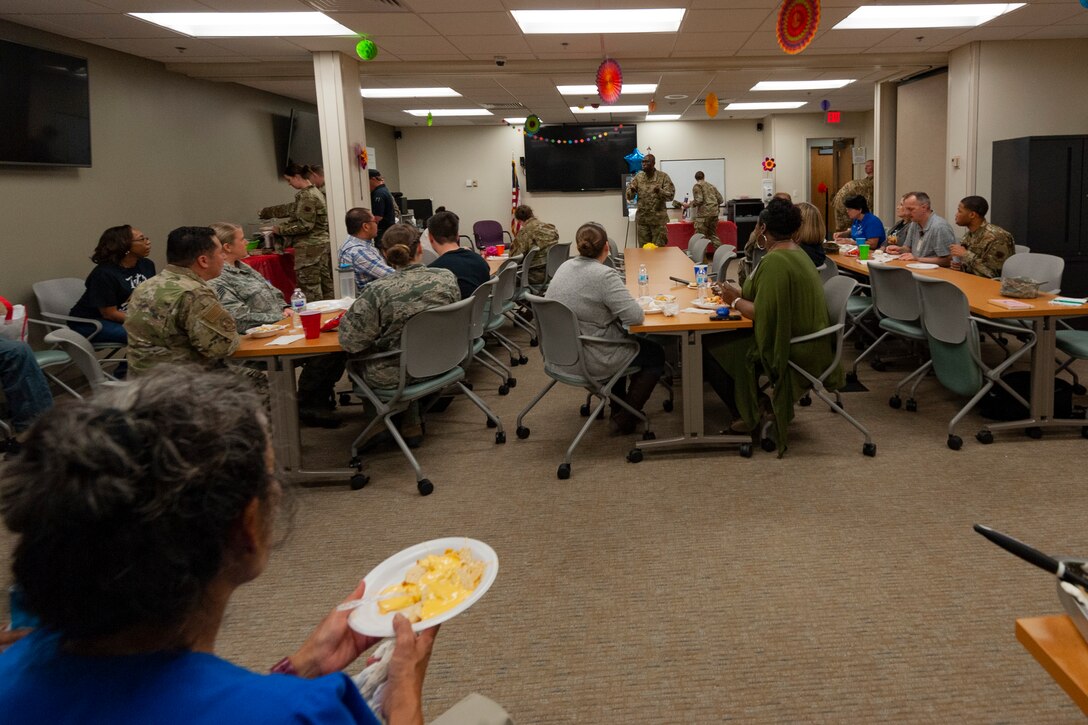 A photo of an Airman giving a briefing