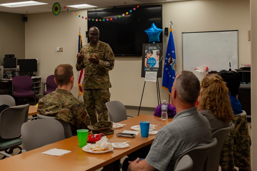 A photo of an Airman giving a briefing