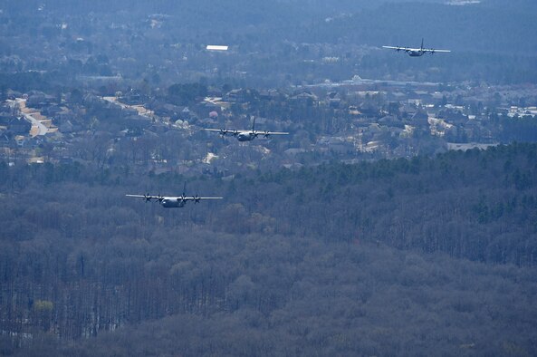 Two C-130J aircraft taking off from runway