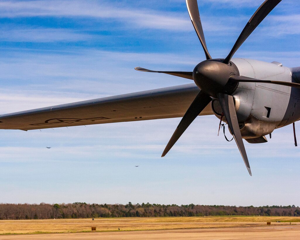 Two C-130J Hercules circle around the runway at Little Rock Air Force Base, Ark. March 7, 2020.